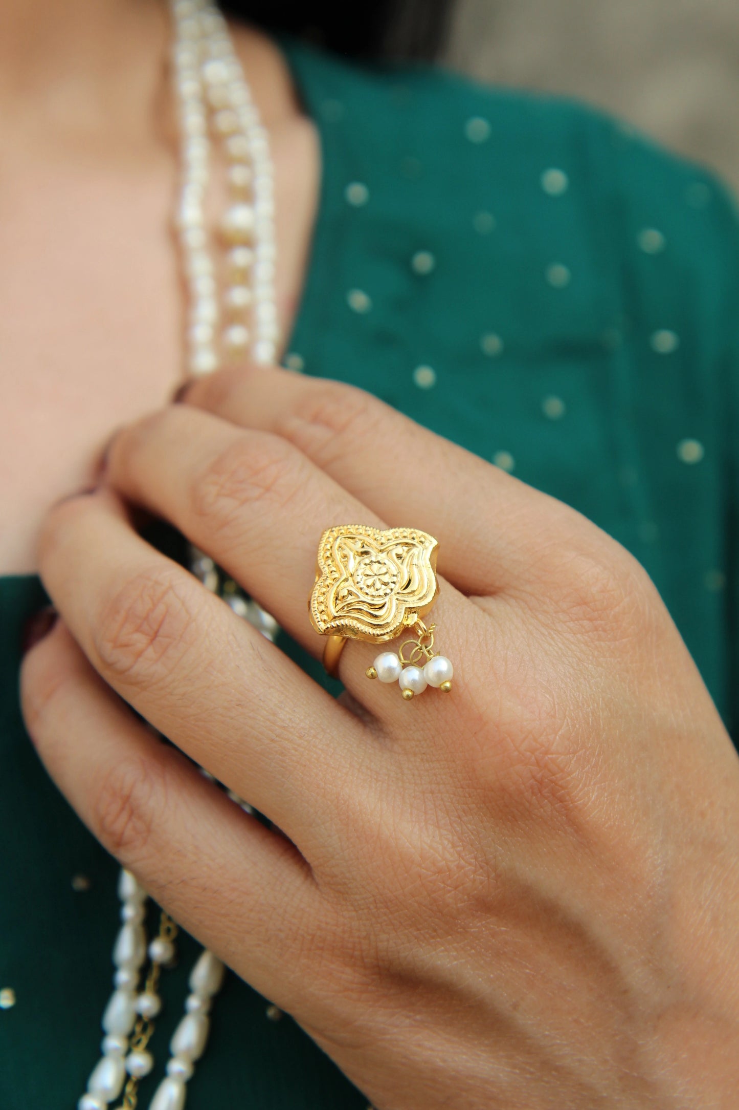 Model wearing Shaheena pearl ring styled for bridal and festive Pakistani jewelry look.