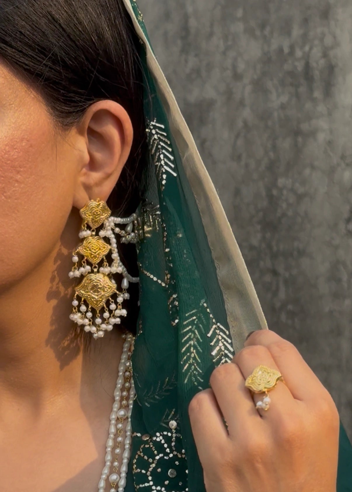 Model wearing Shaheena bridal saharay earrings styled with Pakistani wedding outfit