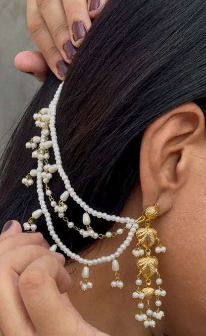 Model wearing Almas pearl bridal saharay earrings styled for Pakistani wedding look