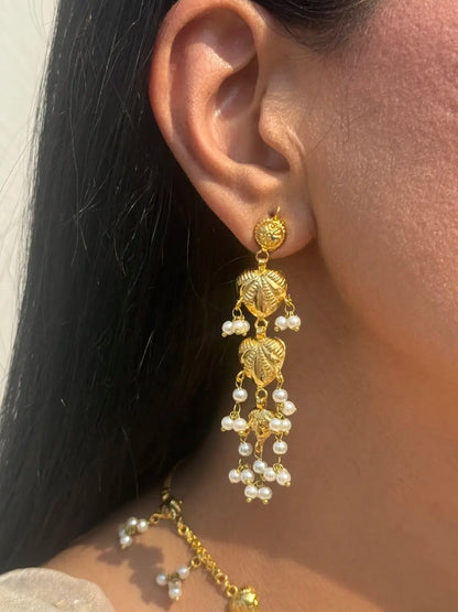 Almas gold earrings with intricate traditional detailing