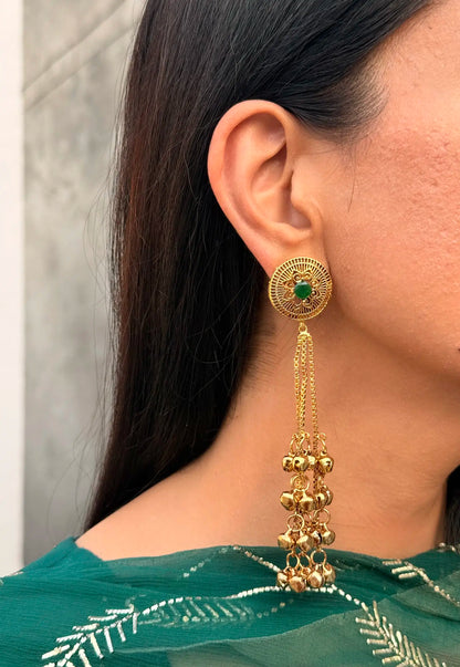 Close-up of emerald Kashmiri jhumka earrings showcasing intricate traditional detailing
