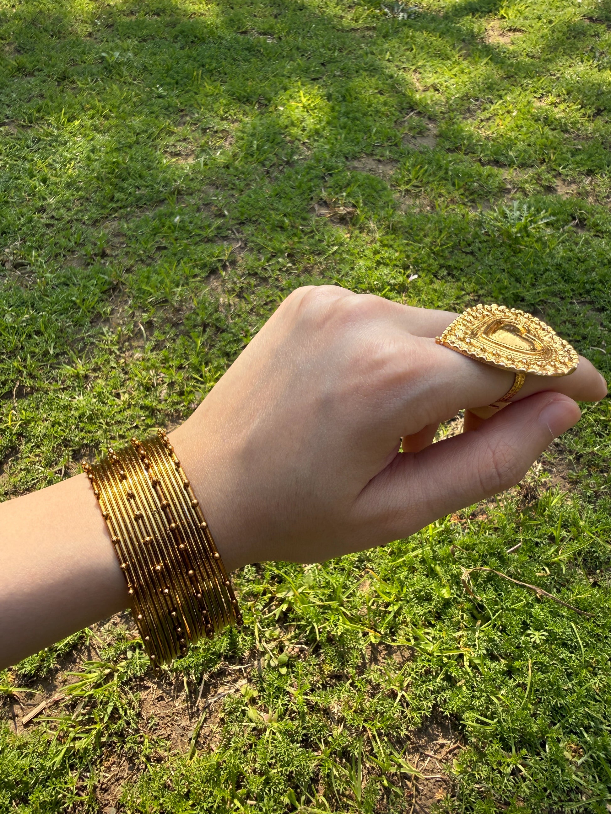 Stacked sajal golden churiyan bangles set for bridal and Eid traditional jewelry styling
