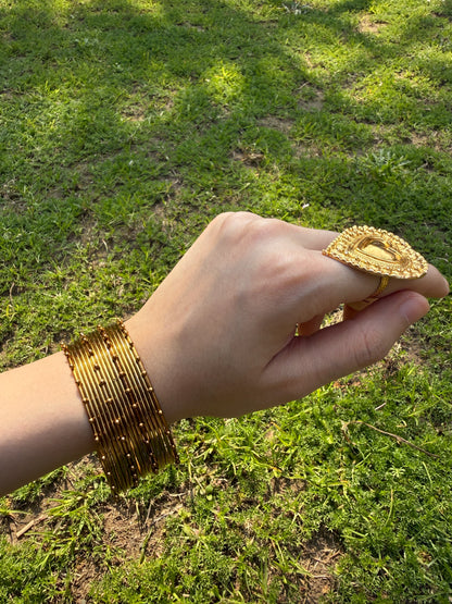 Stacked sajal golden churiyan bangles set for bridal and Eid traditional jewelry styling
