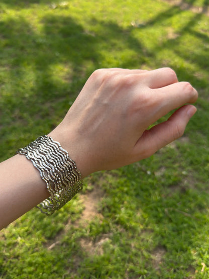 Stacked silver chamkeeli bangles set styled for traditional and festive wear