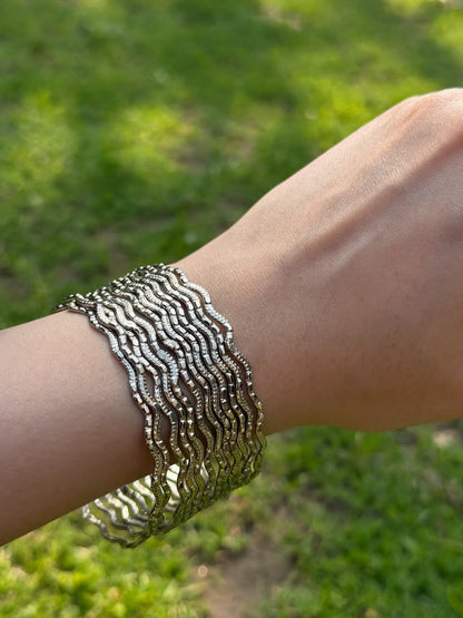 Detailed close-up of silver chamkeeli bangles showing sparkle texture and craftsmanship