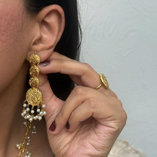 Pearl drop accents and traditional bridal ethnic jewelry look