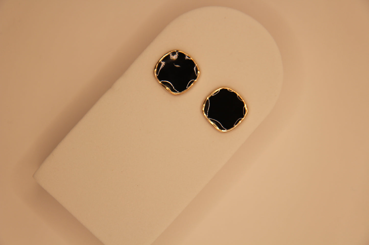 Model wearing Noir Gold black and gold earrings styled for party, daily wear and evening wear
