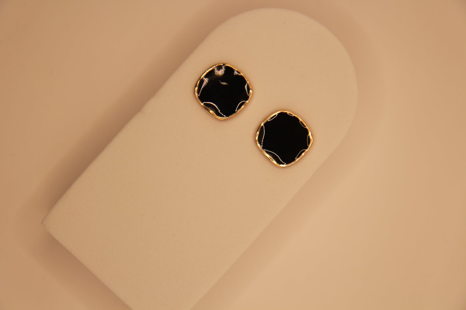 Model wearing Noir Gold black and gold earrings styled for party, daily wear and evening wear
