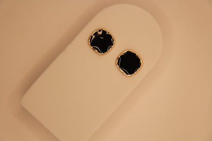 Model wearing Noir Gold black and gold earrings styled for party, daily wear and evening wear
