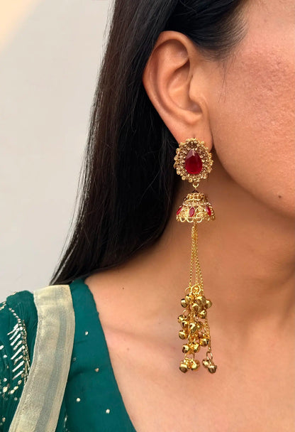Close-up of Ruby Kashmiri jhumka earrings showcasing intricate traditional detailing