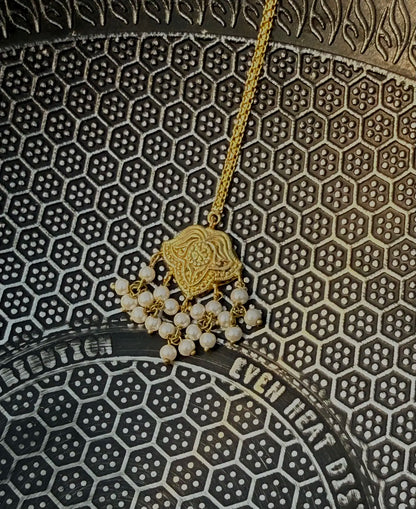 Close-up of Shaheena bridal bindi showing intricate traditional detailing. Pakistani jewelry