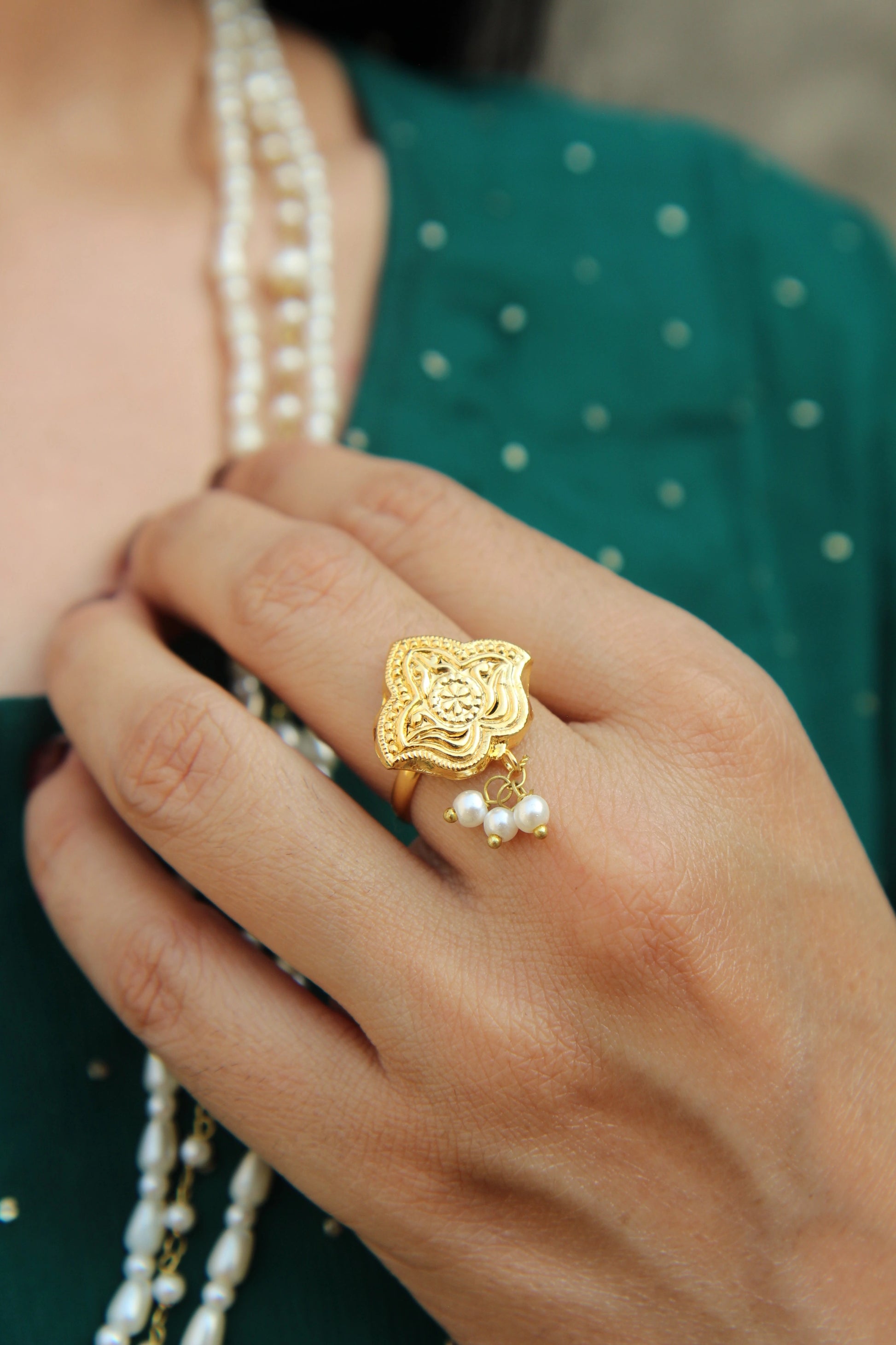 Model wearing Shaheena pearl ring styled for bridal and festive Pakistani jewelry look.