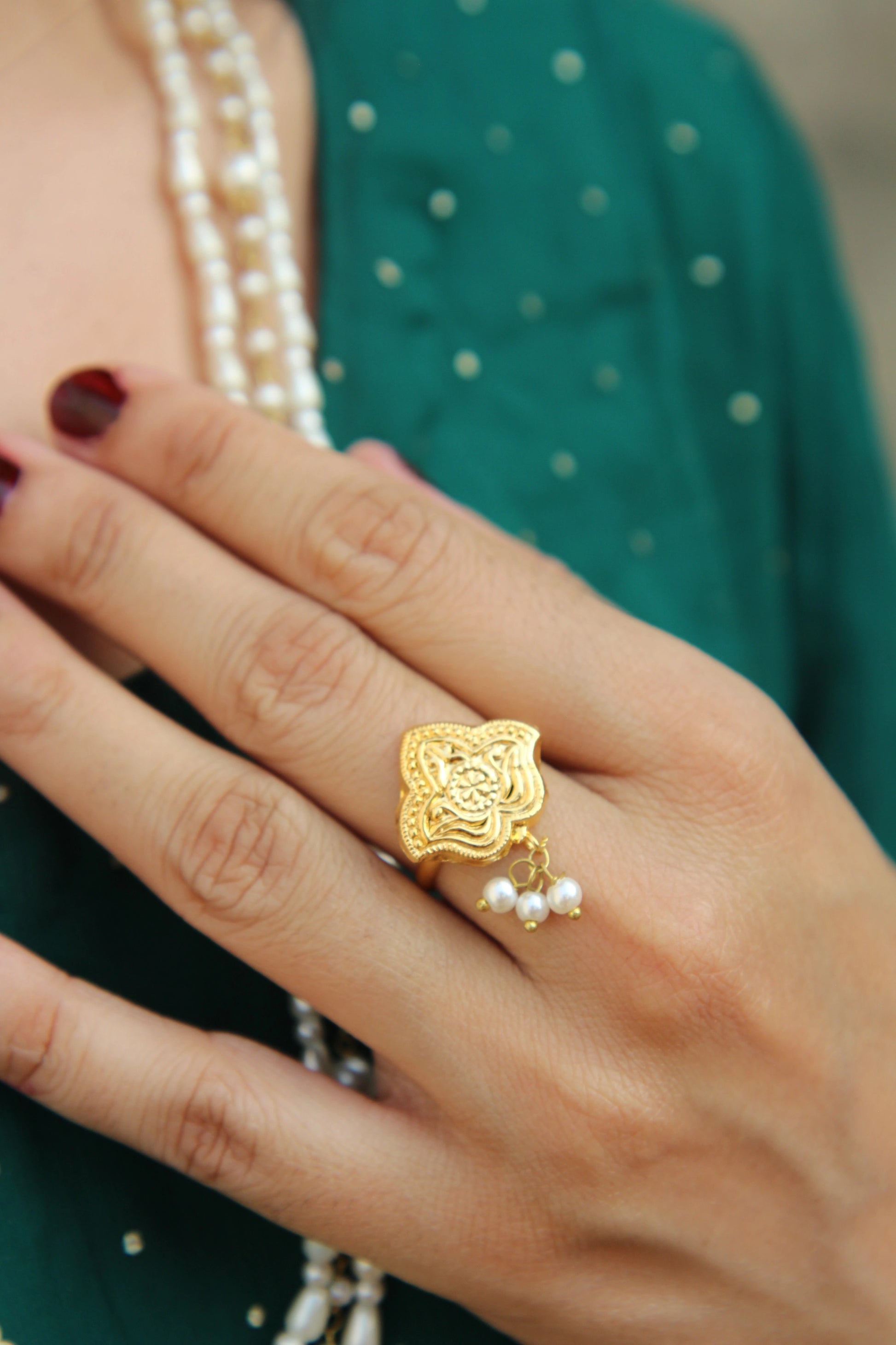 Side view of Shaheena bridal pearl ring with elegant gold and pearl finish