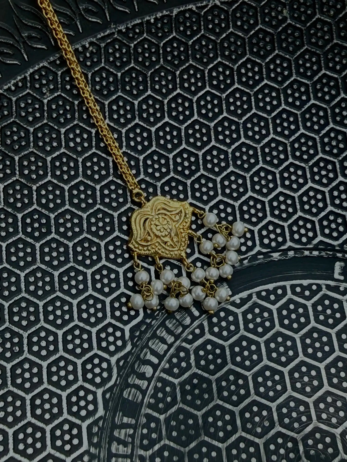 Side angle of Shaheena traditional bindi with gold detailing