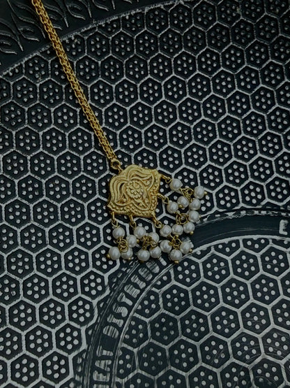 Side angle of Shaheena traditional bindi with gold detailing