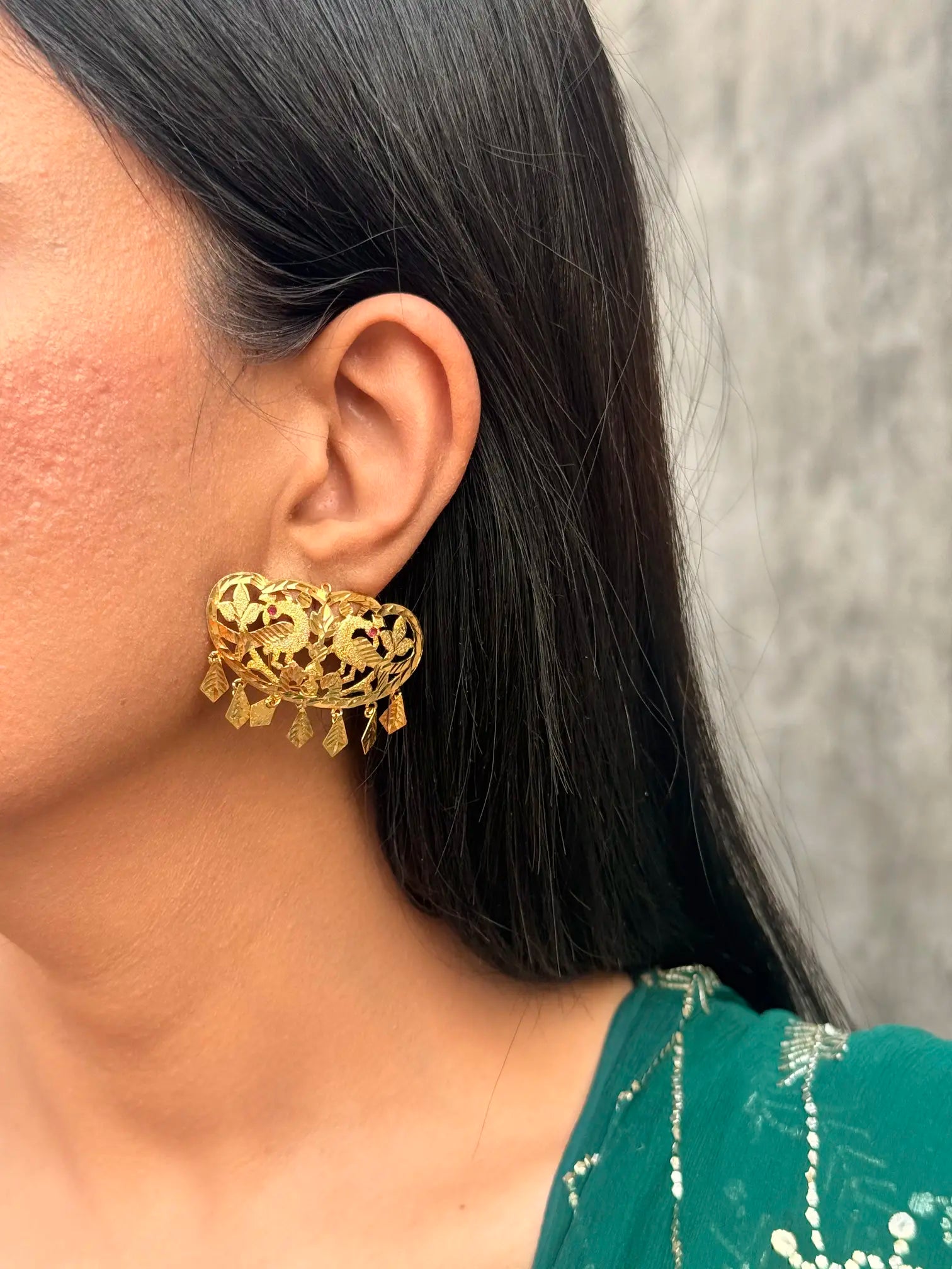 Model wearing Virsa traditional earrings styled for weddings and festive occasions
