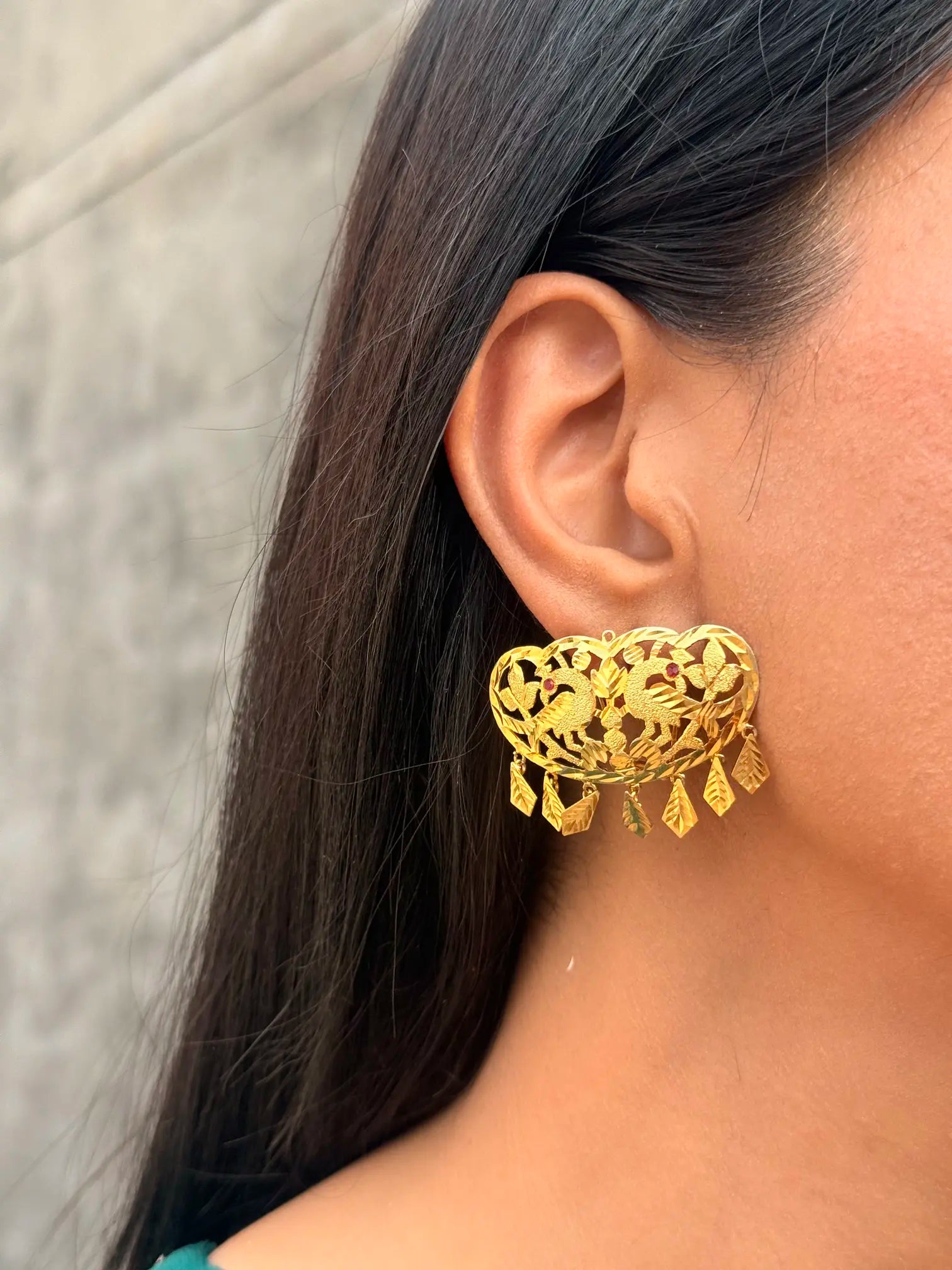 Close-up of Virsa earrings showcasing intricate traditional craftsmanship