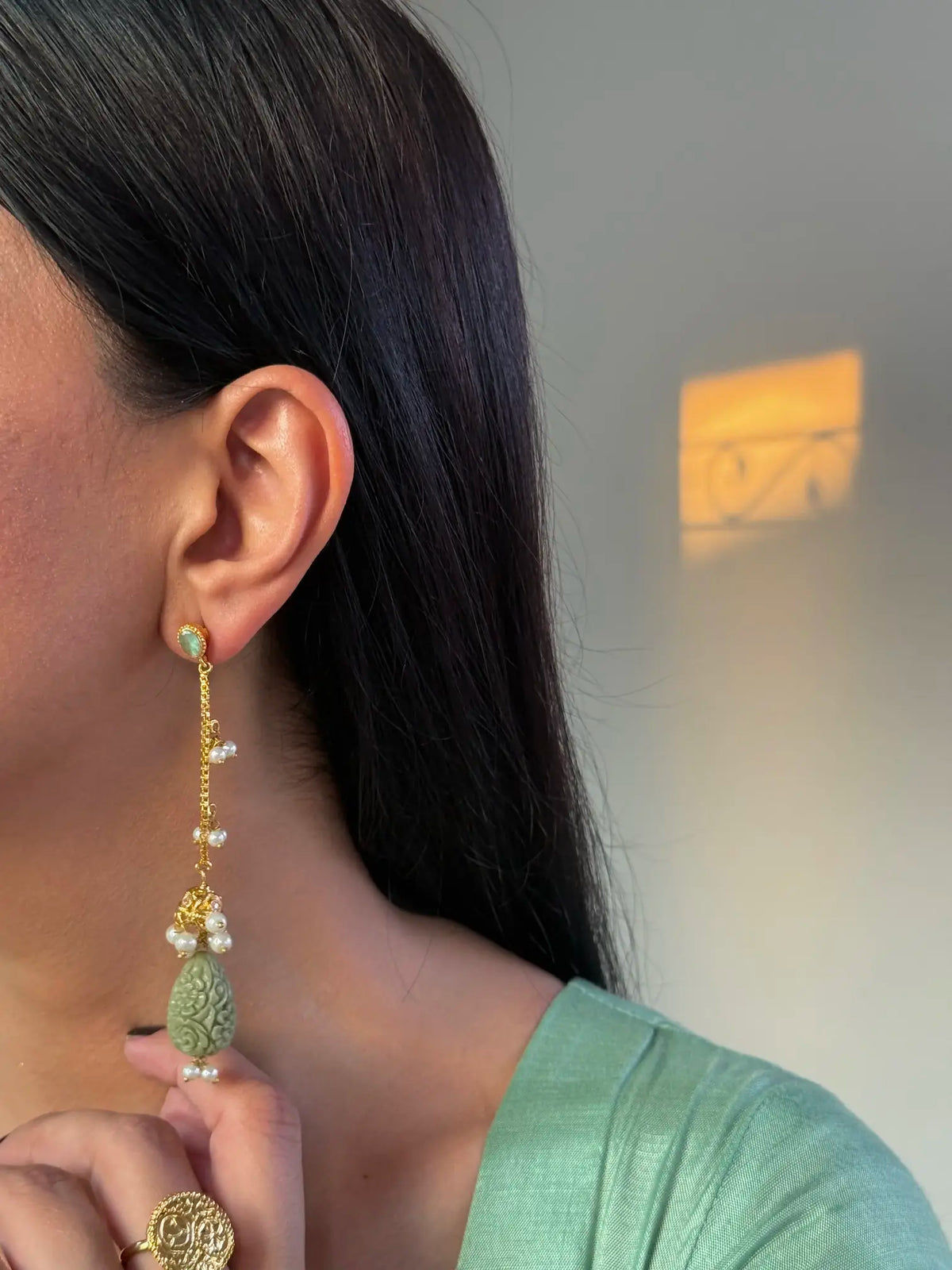 Whimsical sage traditional earrings close-up