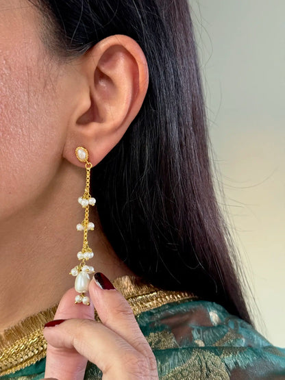 Whimsical swan-inspired pearl earring close-up