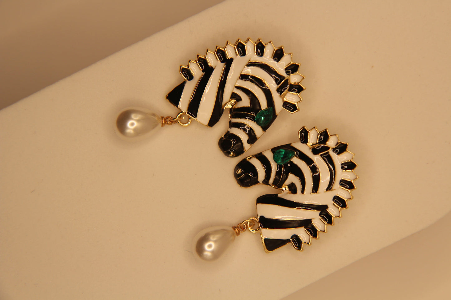 Close‑up of zebra drops earrings showing pattern detail and pearl embellishment by Legacy by Bisma