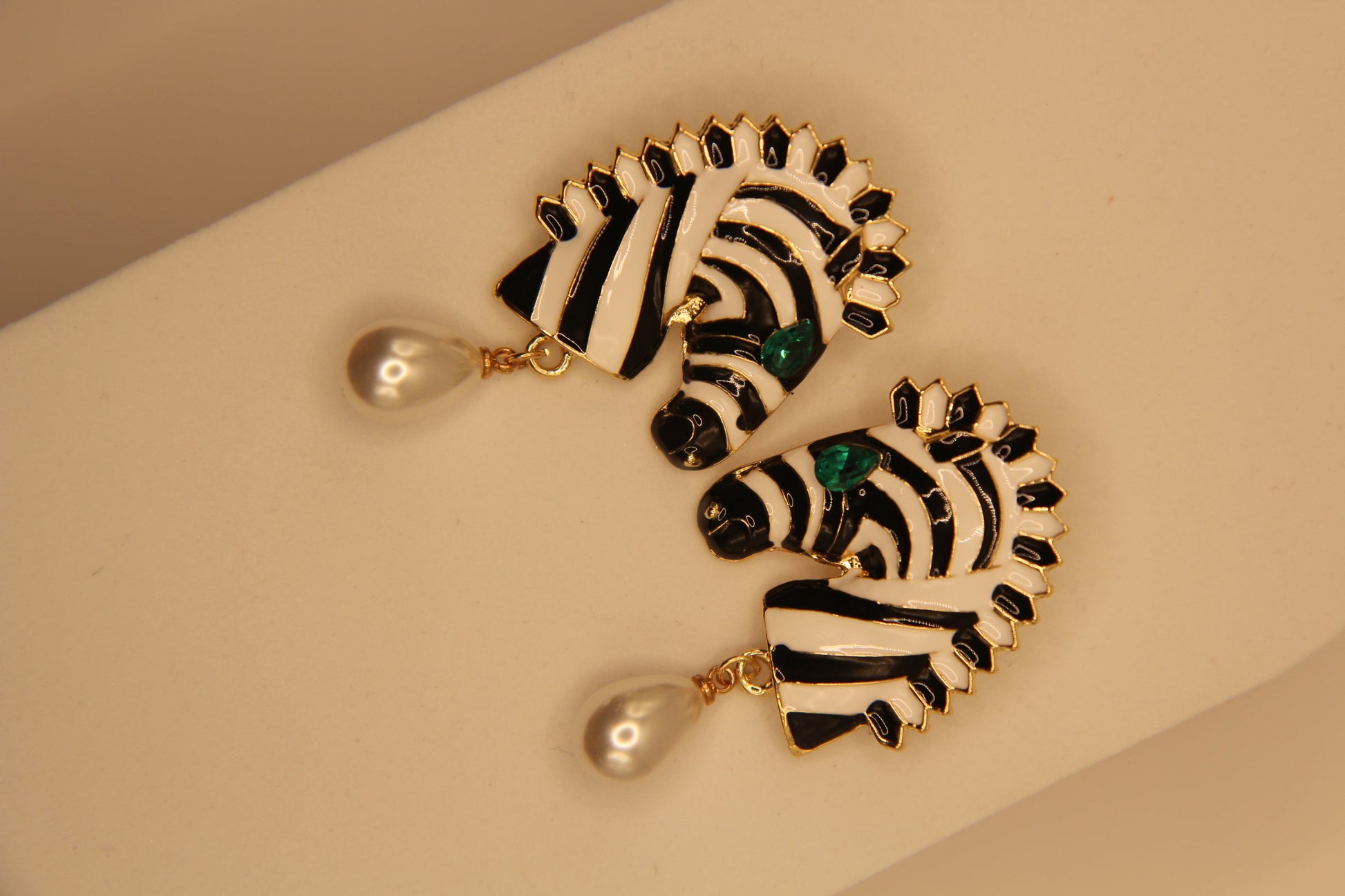Close‑up of zebra drops earrings showing pattern detail and pearl embellishment by Legacy by Bisma