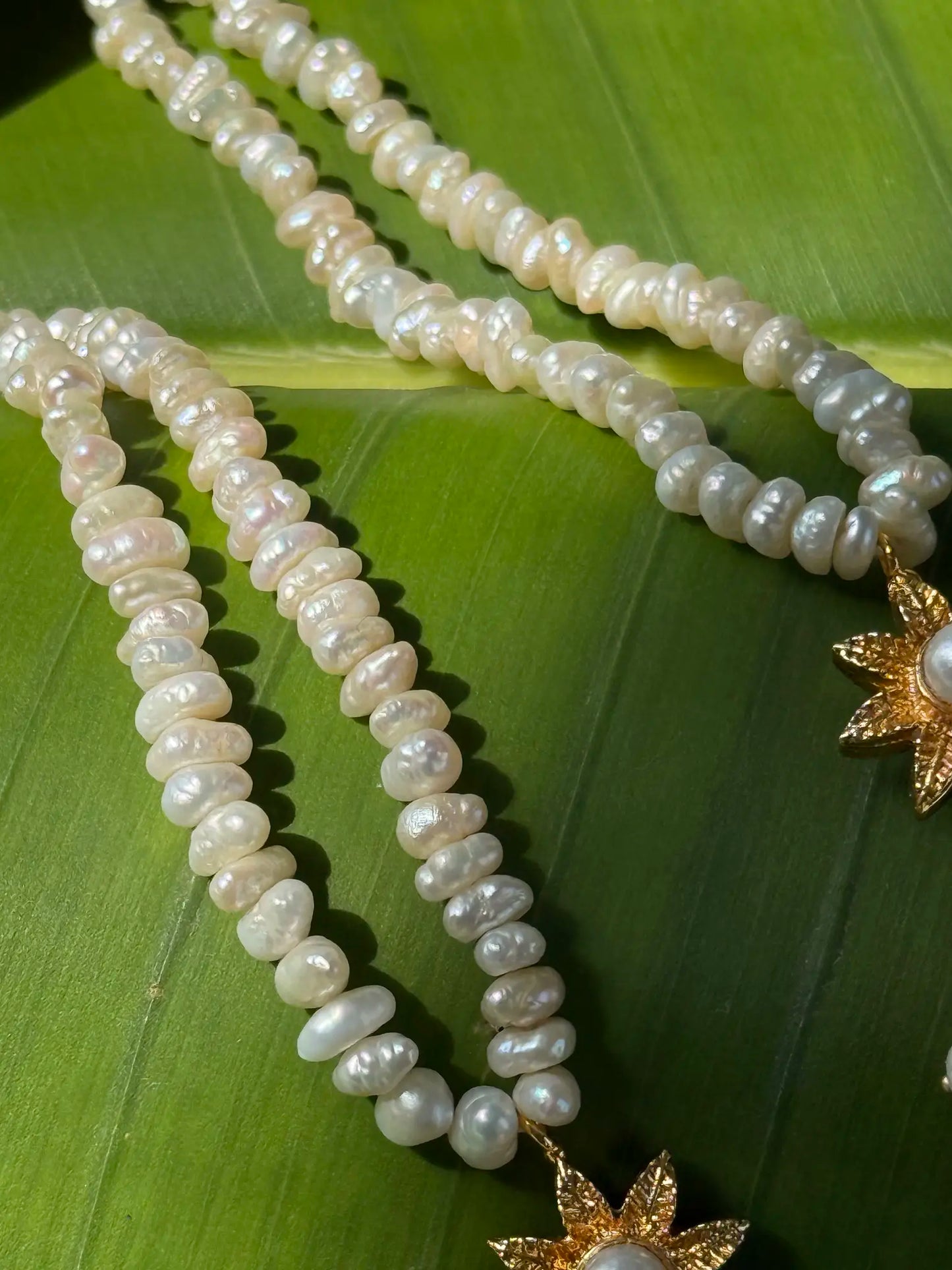 Close-up of Damini pearl gold plated earrings featuring delicate pearl detailing