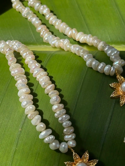 Close-up of Damini pearl gold plated earrings featuring delicate pearl detailing