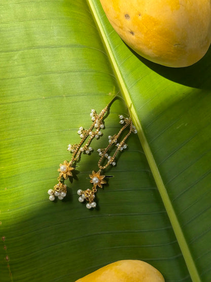 Close-up of Meenu lightweight gold plated pearl earrings with elegant detailing