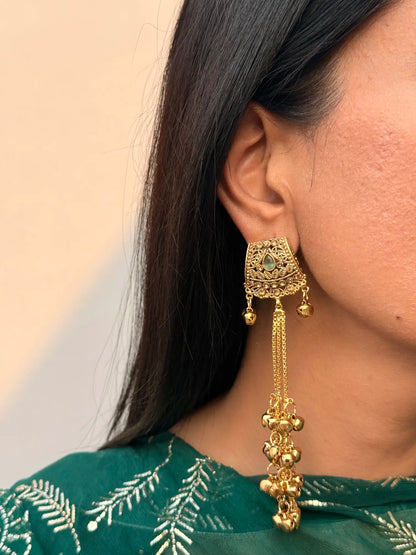 Model wearing mint green Kashmiri jhumka earrings with traditional festive outfit