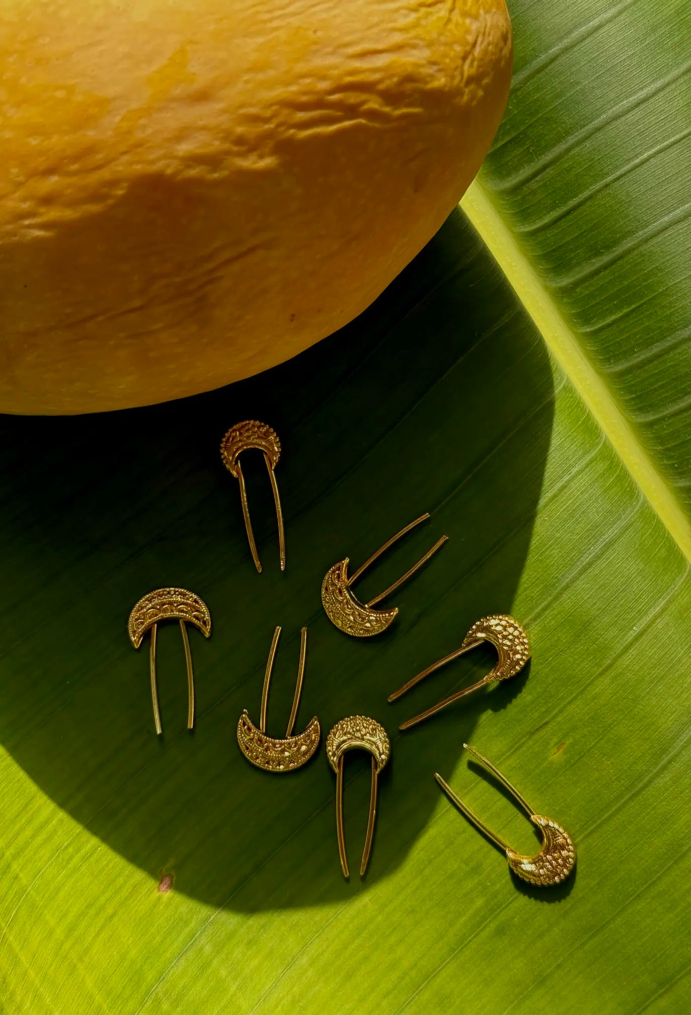 Chand hair pins styled in an elegant bridal updo for mehndi and wedding events