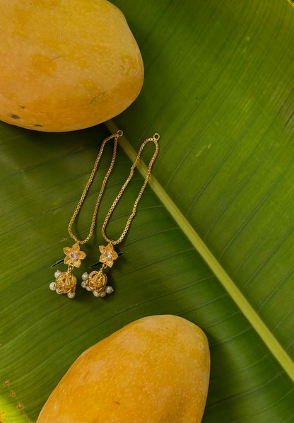 Close-up of Waseela gold plated chain earrings showcasing intricate chain detailing