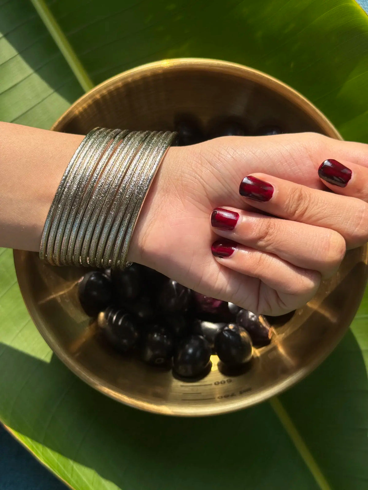 Silver metal Pakistani churi close-up with zari 